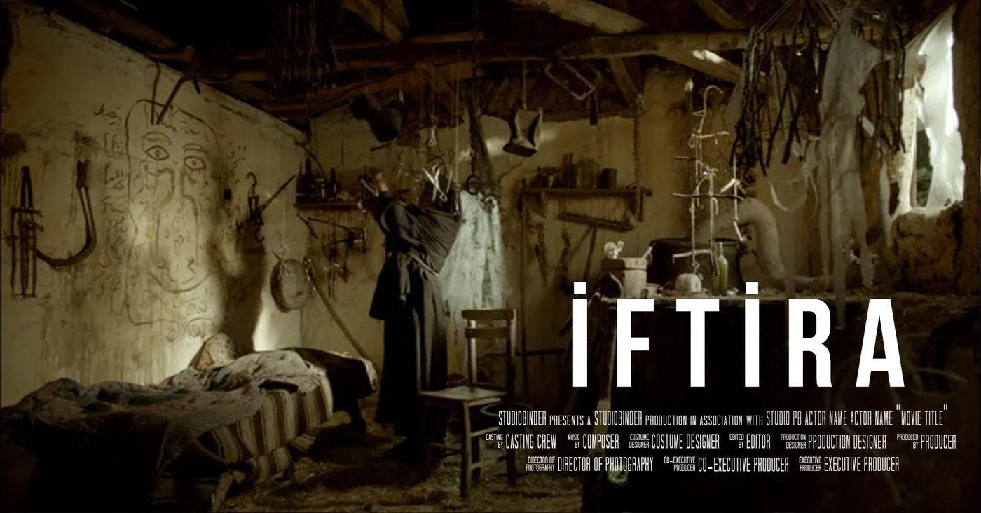 A robed figure in a dim, cluttered room hung with tools and cloth, beside the title İftira